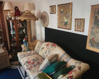 Multiple Lamps, Asian Wall art with Bamboo motif, Vintage couch, Curio Cabinet with vintage figurines and Decanter tops
