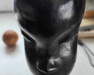 A vintage, handcarved African woman sculpture