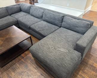 Modern West Elm Enzo sectional with Pewter textured performance chenille fabric. https://www.westelm.com/products/enzo-reclining-chaise-sectional-w-storage-h4598/?catalogId=71&sku=6276858&pickuplocation=ST:%7Bstore_code%7D&cm_ven=PLA&cm_cat=Google&cm_pla=Furniture%20%3E%20Sectionals&cm_ite=6276858_14464751978_pla-874217356287&gad_source=1&gad_campaignid=14464751978&gbraid=0AAAAABjYLmno7_HgKR6so6bNcyxVV2Q_L&gclid=CjwKCAjwvNfSBhBiEiwAyaGMCdK6KDmaChM9o3UpqlIkc912RJZkrrLdKWvrIIMr-fc4zZRq3oDi4xoCTP4QAvD_BwE