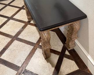 Tuscan carved console / writing desk. Stunning architectural carved base with a contrasting ebony top. Two working drawers. Heavy, solid wood construction with beautifully-intricate hand-carved details. Perfect for an entryway, or an office. Has two working drawers.