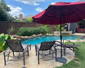 Chaise Lounges and umbrella from Sunnyland Outdoor Living. The Lounges need new fabric.