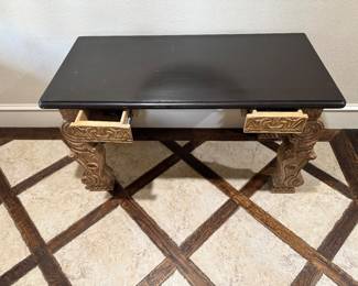 Tuscan carved console / writing desk. Stunning architectural carved base with a contrasting ebony top. Two working drawers. Heavy, solid wood construction with beautifully-intricate hand-carved details. Perfect for an entryway, or an office. Has two working drawers.