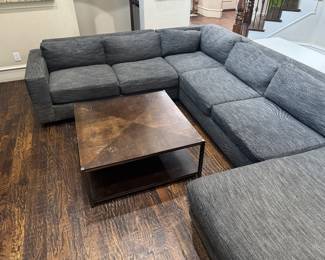Modern West Elm Enzo sectional with Pewter textured performance chenille fabric. https://www.westelm.com/products/enzo-reclining-chaise-sectional-w-storage-h4598/?catalogId=71&sku=6276858&pickuplocation=ST:%7Bstore_code%7D&cm_ven=PLA&cm_cat=Google&cm_pla=Furniture%20%3E%20Sectionals&cm_ite=6276858_14464751978_pla-874217356287&gad_source=1&gad_campaignid=14464751978&gbraid=0AAAAABjYLmno7_HgKR6so6bNcyxVV2Q_L&gclid=CjwKCAjwvNfSBhBiEiwAyaGMCdK6KDmaChM9o3UpqlIkc912RJZkrrLdKWvrIIMr-fc4zZRq3oDi4xoCTP4QAvD_BwE