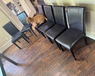 Faux leather Parson’s chairs. Limerick (the Irish Terrier) is not for sale