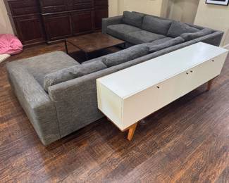 Modern West Elm Enzo sectional with Pewter textured performance chenille fabric. https://www.westelm.com/products/enzo-reclining-chaise-sectional-w-storage-h4598/?catalogId=71&sku=6276858&pickuplocation=ST:%7Bstore_code%7D&cm_ven=PLA&cm_cat=Google&cm_pla=Furniture%20%3E%20Sectionals&cm_ite=6276858_14464751978_pla-874217356287&gad_source=1&gad_campaignid=14464751978&gbraid=0AAAAABjYLmno7_HgKR6so6bNcyxVV2Q_L&gclid=CjwKCAjwvNfSBhBiEiwAyaGMCdK6KDmaChM9o3UpqlIkc912RJZkrrLdKWvrIIMr-fc4zZRq3oDi4xoCTP4QAvD_BwE