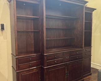 Weir’s Traditional cherry entertainment center with motorized TV lift and built-in accent lighting. Very heavy. Remote included.
