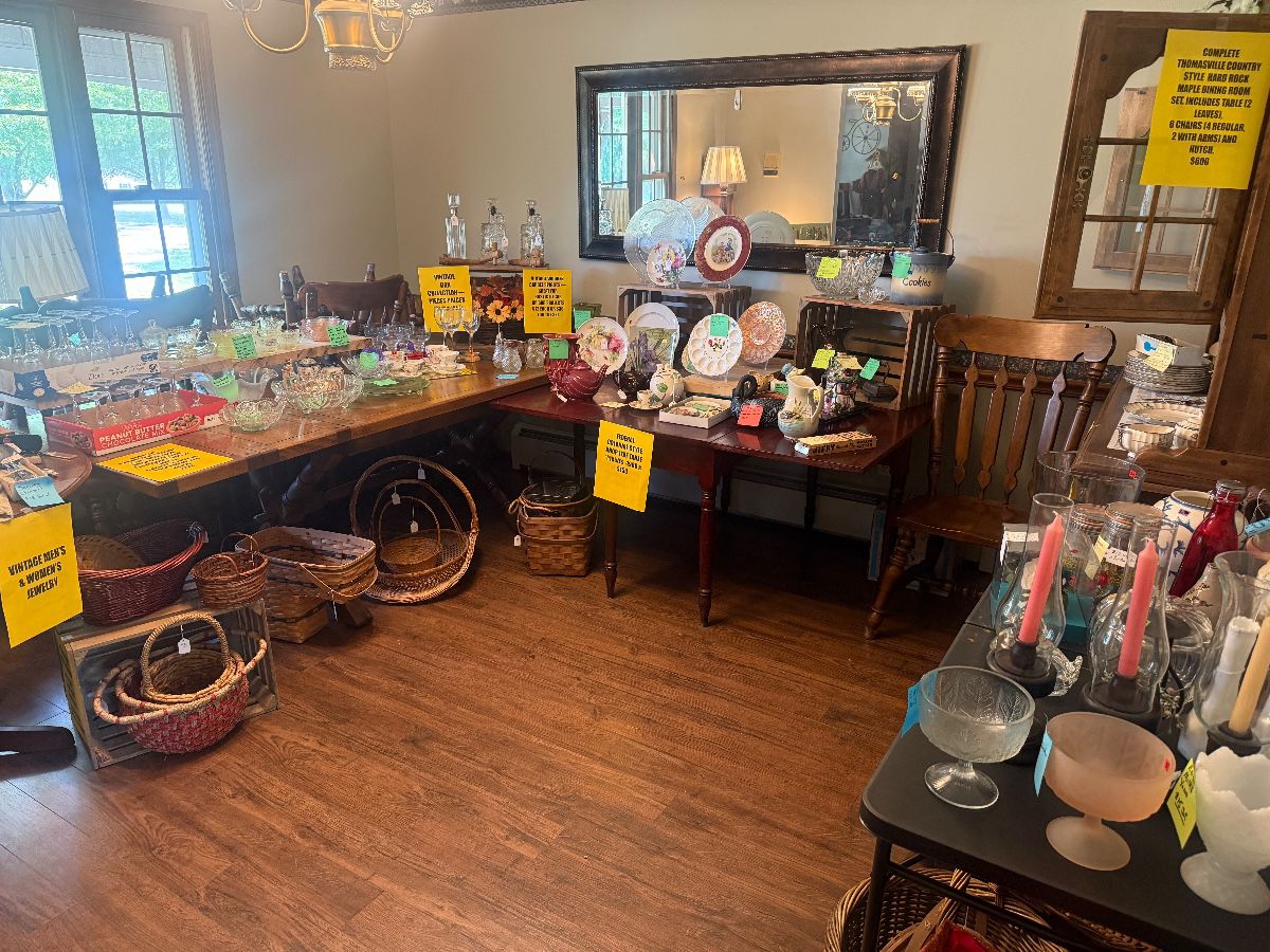 The Dining Room - A collector’s delight, Here you’ll find a gorgeous THOMASVILLE County-style hard rock maple dining set with six chairs, vintage glassware, decorative plates and serving pieces. As well as a wide variety of baskets and men and women’s jewelry.