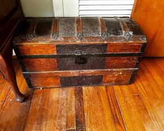 ANTIQUE CAMELBACK CHEST.