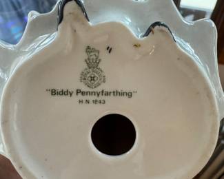 Royal Doulton “Biddy Pennyfarthing” Woman, and man pair