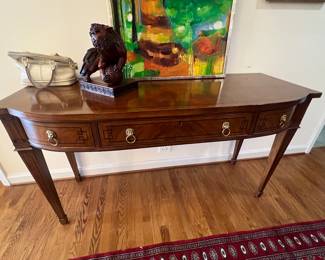 Baker Furniture Neoclassical Mahogany Bowfront Console Table with Brass Lion Ring Pulls