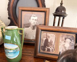 Antique portrait photographs and souvenir vase