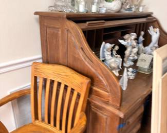Antique oak roll top desk with chair, porcelain figurines