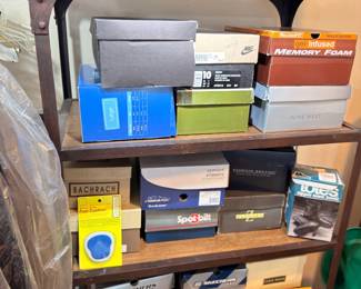 Shelf of boxed shoes and household goods