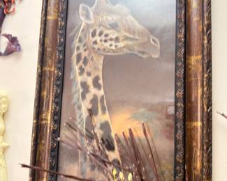 Framed giraffe art print in ornate frame