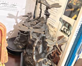 Bronze dragonfly sculpture on marble base