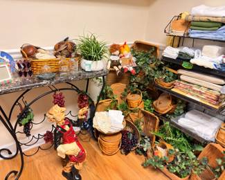 Baskets, linens, wine rack table, and kitchen decor