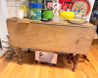 Antique drop leaf table, vintage kitchen tins and Coca-Cola tray