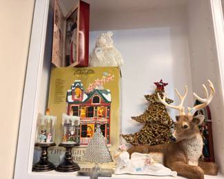 Christmas village house, reindeer, and holiday figures