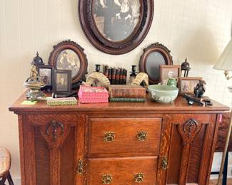 Antique carved oak sideboard, antique oval framed portraits