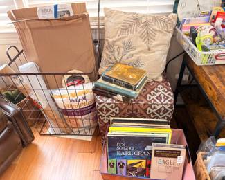 Vinyl records including Eagles, books, and pillows