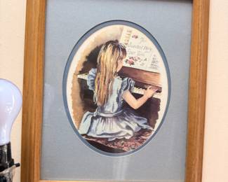 Framed print, girl at piano, oval matted