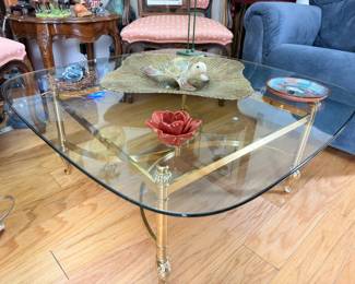 Glass top coffee table with brass base