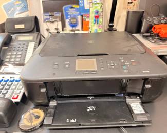 Canon all-in-one printer, office phone, and supplies