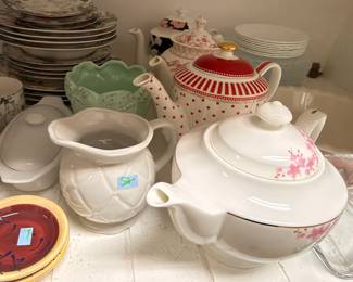 Assorted teapots, pitchers, and china dishware