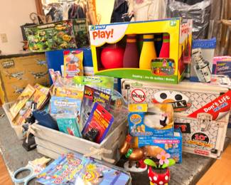 Basket of new toys and games, Operation, bowling set, puzzles