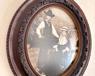 Antique oval carved wood frame with early photograph