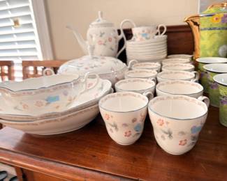Floral china tea set with teapot, cups, and gravy boat