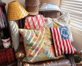 Leather recliner, throw pillows, and lamp shades
