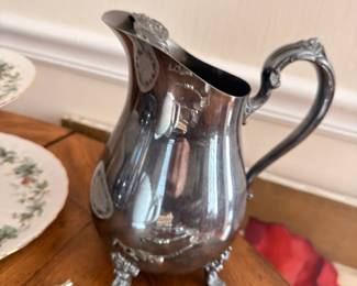 Ornate silver plate footed water pitcher