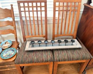 Mission style oak lattice-back chairs, candle centerpiece, collector plates