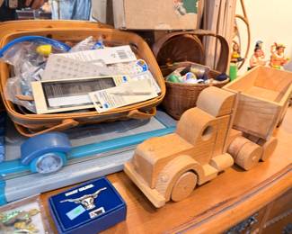 Handmade wooden toy truck, baskets, and belt buckle