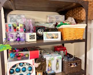 Shelf of Christmas ornaments, baskets, and holiday decor