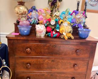 Antique burl walnut chest of drawers, jester dolls