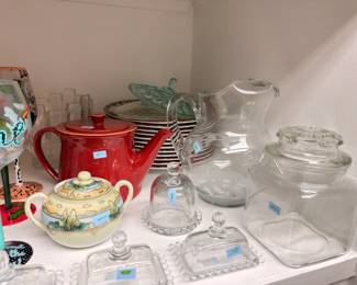 Glass butter dishes, apothecary jar, teapots, kitchen glassware