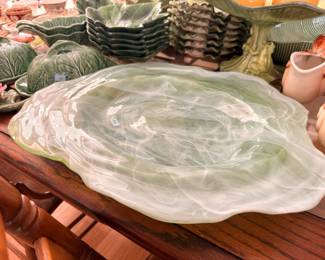 Large swirl art glass platter, majolica lettuce ware behind
