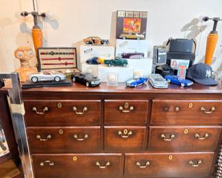 Cherry triple dresser, diecast cars, collectibles on top