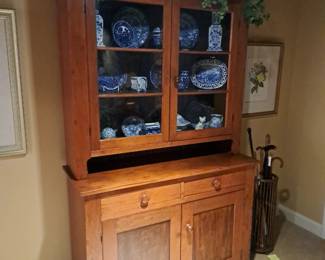 Antique Victorian two part kitchen cupboard filled with flow blue and antique blue and white china.