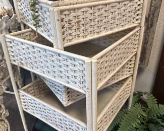 vintage wicker swing-out shelf unit with four multi-use storage areas and a white finish