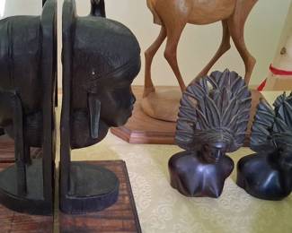 vintage hand-carved ebony wood bookends depicting stylized African portraits or tribal busts