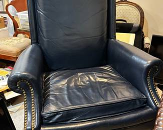Executive blue leather arm chair with swivel wooden base