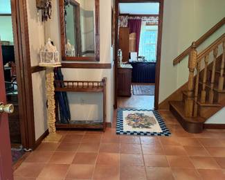 Entrance to the home. Turn left for the living room. Go straight for the dining room. Go right for the kitchen, basement, holiday, and craft rooms.