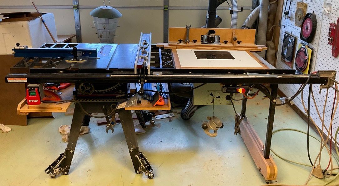  Craftsman Contractor Table Saw   220v Cast iron table with cast iron wings After market Upgrades:  Paddle stop power switch.  Incra V27 miter gauge Miter gauge fence with work stop Shop Fox Fence and 54” table extension no Built in Router Table with dust collection box and Dewalt Router installed.  Riving Knife.  Link belt.   Balanced v pulleys (available but not installed)  4” dust collection with blast gates for saw and router. Retractable Casters 