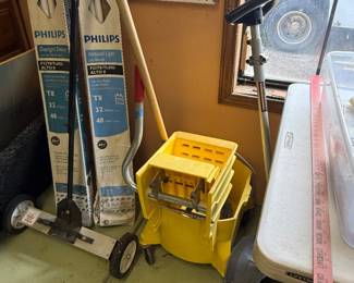 Mop bucket and cleaning supplies 