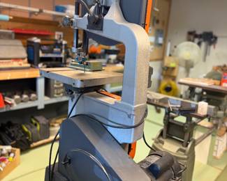  3/4 HP, 120/240V single phase. 13-1/2" throat and 6" under blade guides. Table dimension’s 14" x 14" cast iron, tilts up to 45 degrees. On open stand rolling base After market upgrades: Carter Quick Release blade tension adjuster.  The Carter conversion kit sealed ball bearing roller guides. 