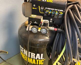 This is a Central Pneumatic 21-gallon air compressor with a 2.5 horsepowermotor. It has a maximum pressure rating of 125 PSI. The unit features dual pressure gauges for monitoring tank and outlet pressure.