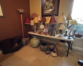 Variety of lamps, candle holders and decorative vases